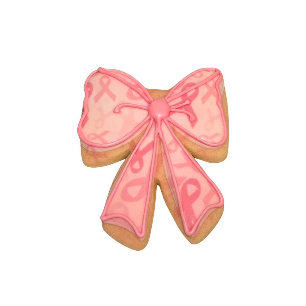 Breast Cancer Awareness bow-shaped cookie with pink icing.