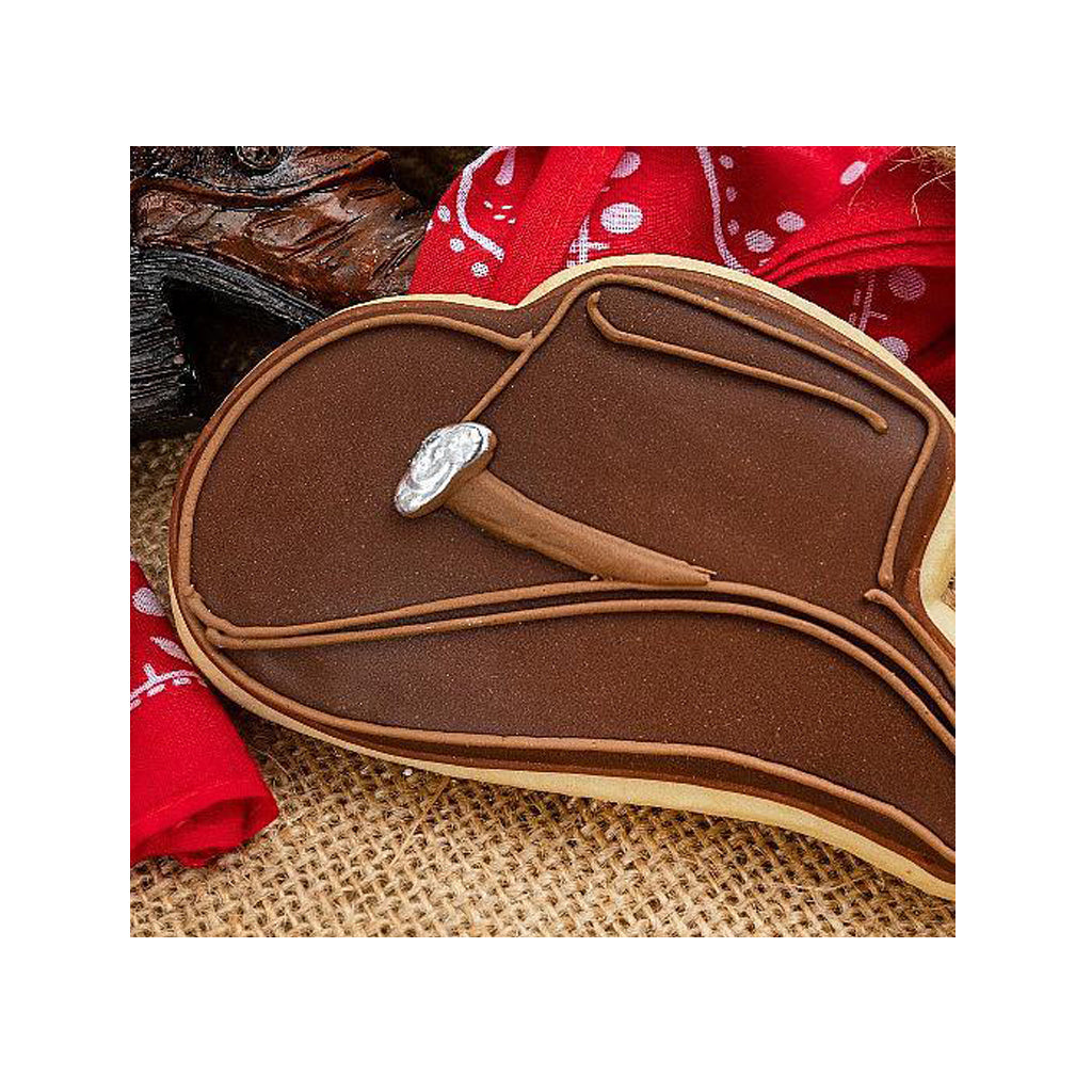 Brown cowboy hat shaped cookie with chocolate icing