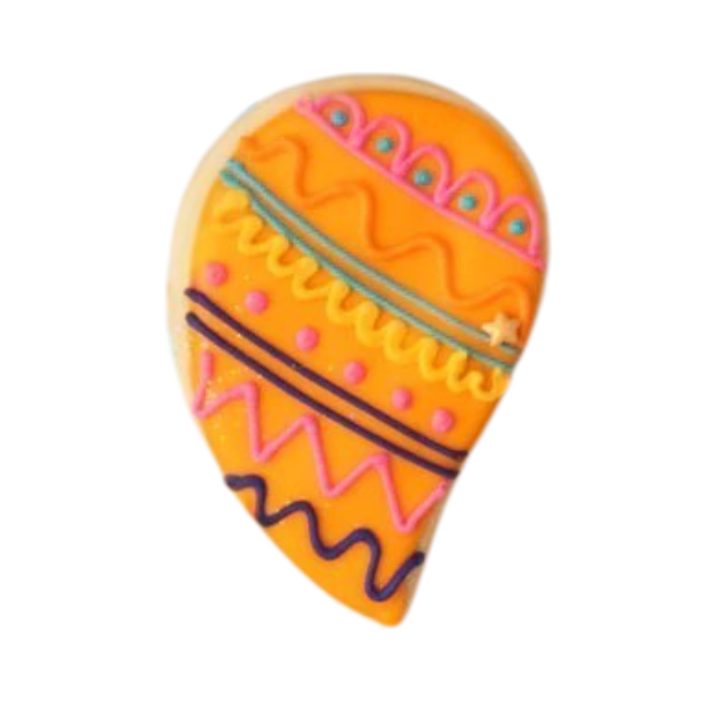 Diwali cookie with orange icing and colorful piped patterns.