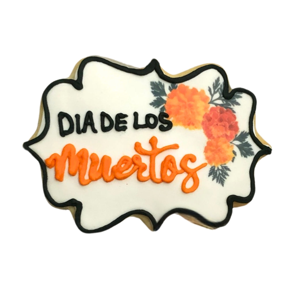 Day of the Dead cookie with orange marigold icing.