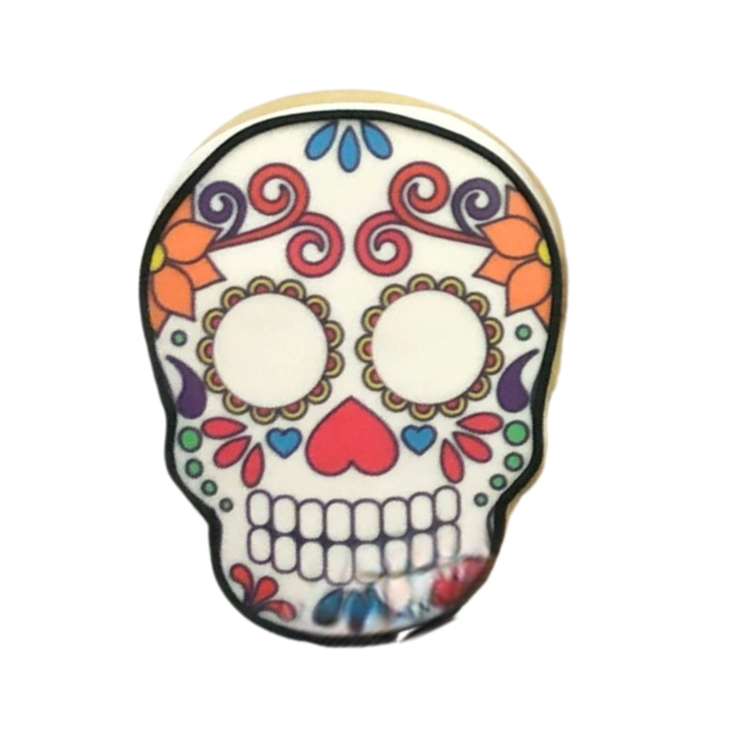 Day of the Dead sugar cookie with colorful skull icing.