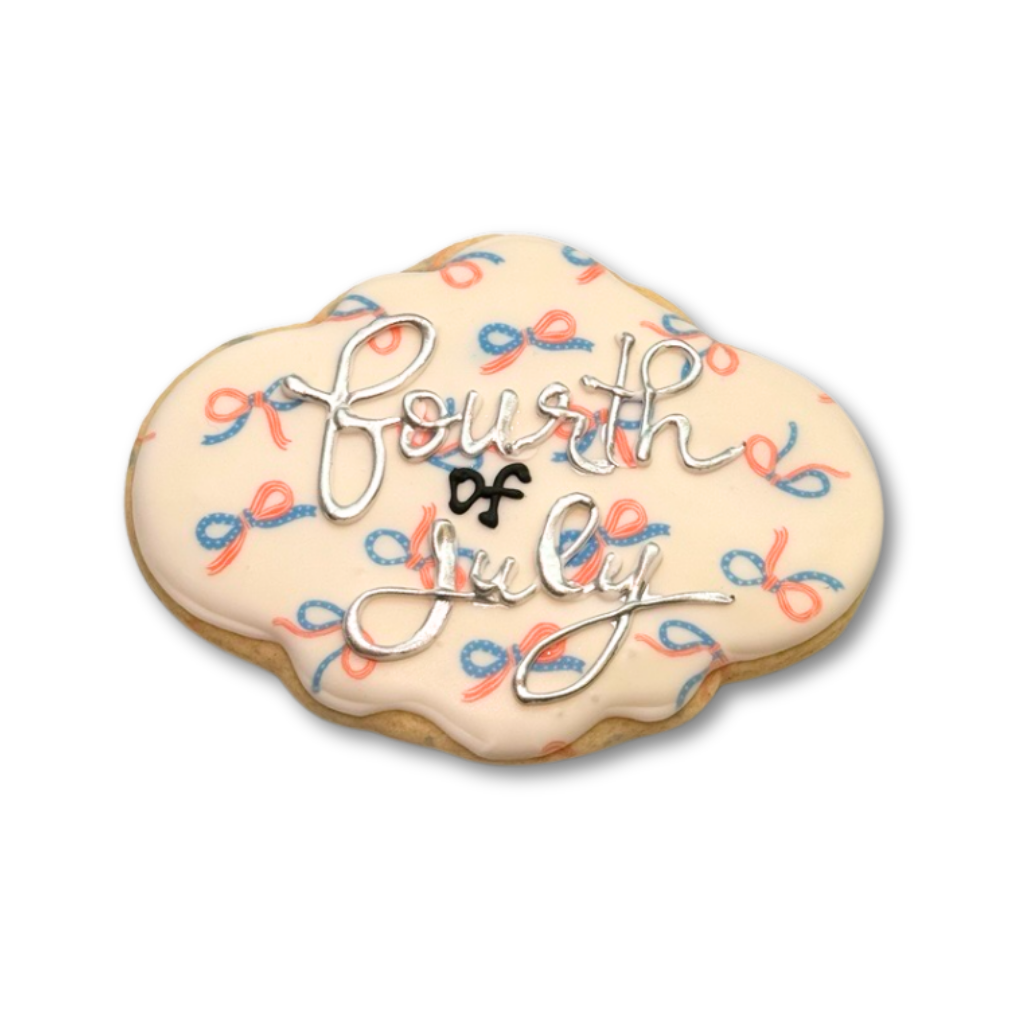 4th of July cookie with red and blue bow pattern icing