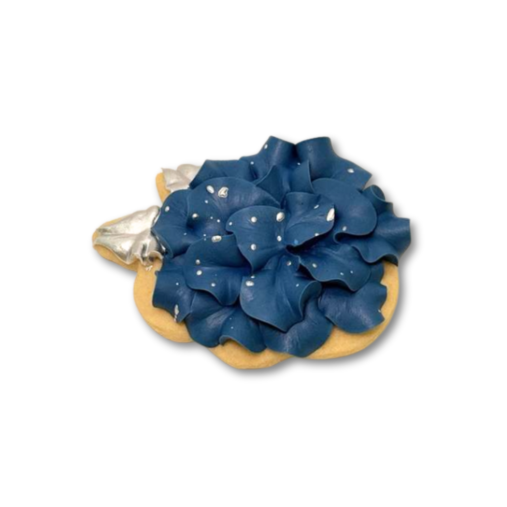 4th of July cookie with blue ruffled icing and silver accents