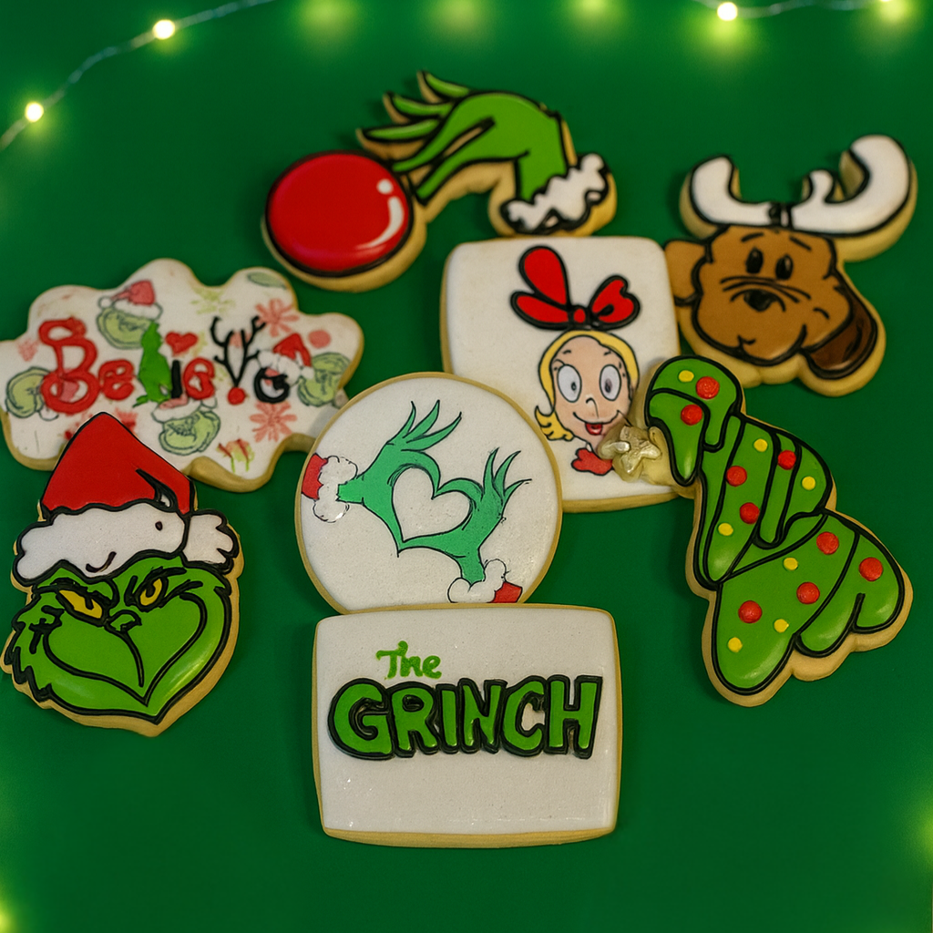 Merry Grinchmas cookies with colorful icing on green background.