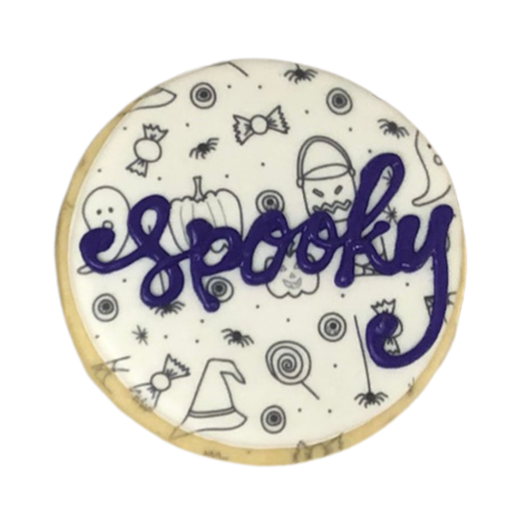 Round Halloween cookie with Spooky text and festive icons.