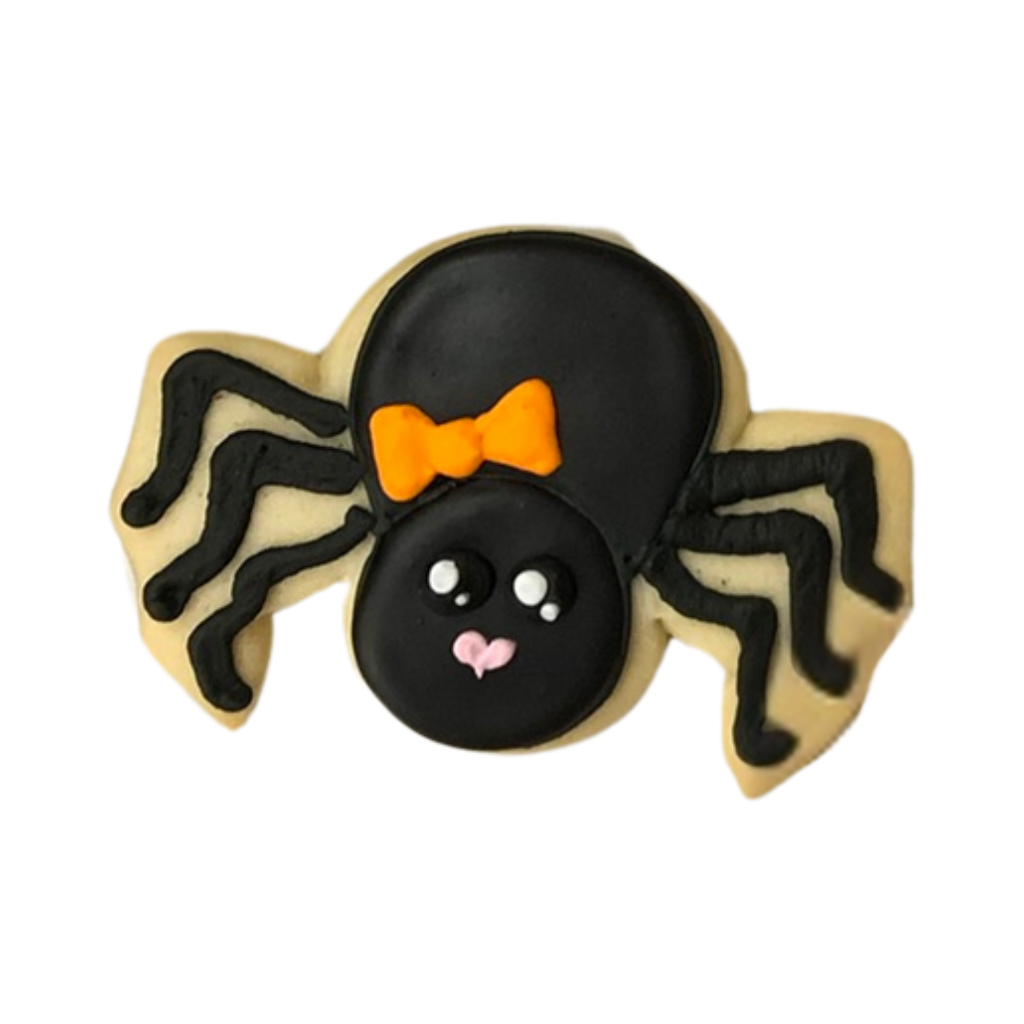 Halloween spider cookie with an orange bow and icing.