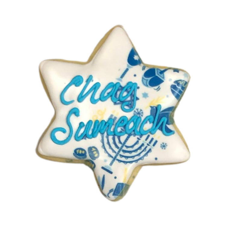 Star-shaped Hanukkah cookie with blue Chag Sameach icing.