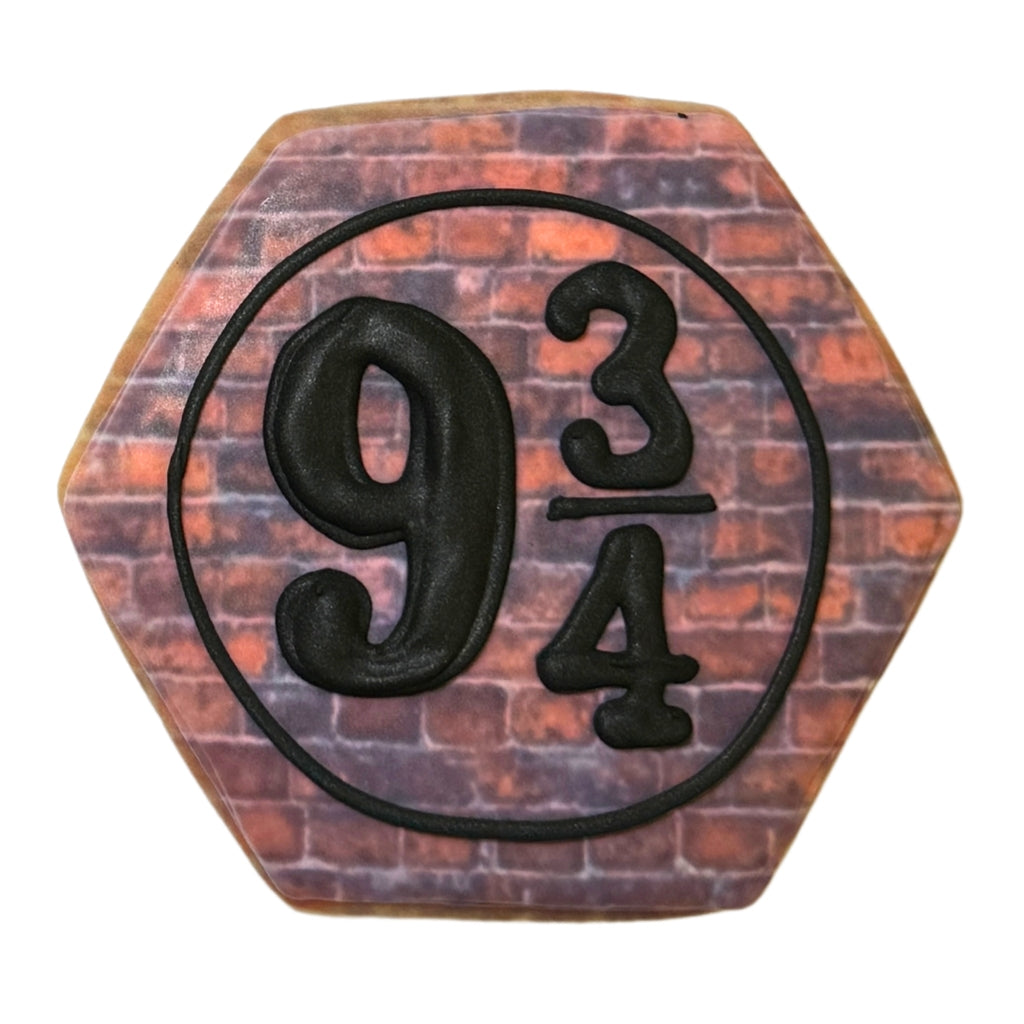 Harry Potter 9 3/4 cookie with a brick wall design.