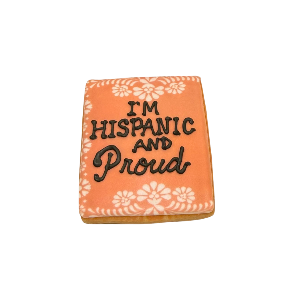 Hispanic Heritage cookie with orange icing and floral border.