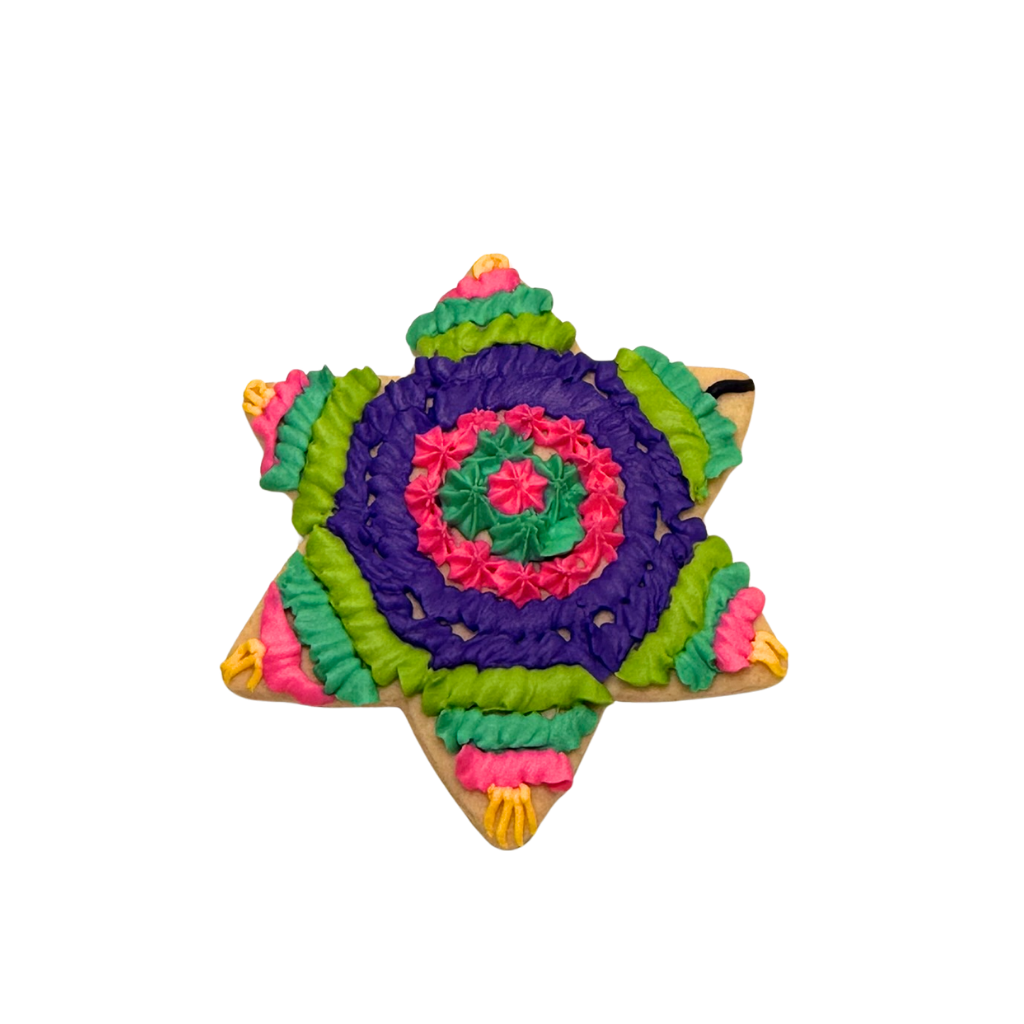 Hispanic Heritage star-shaped cookie with colorful frosting.