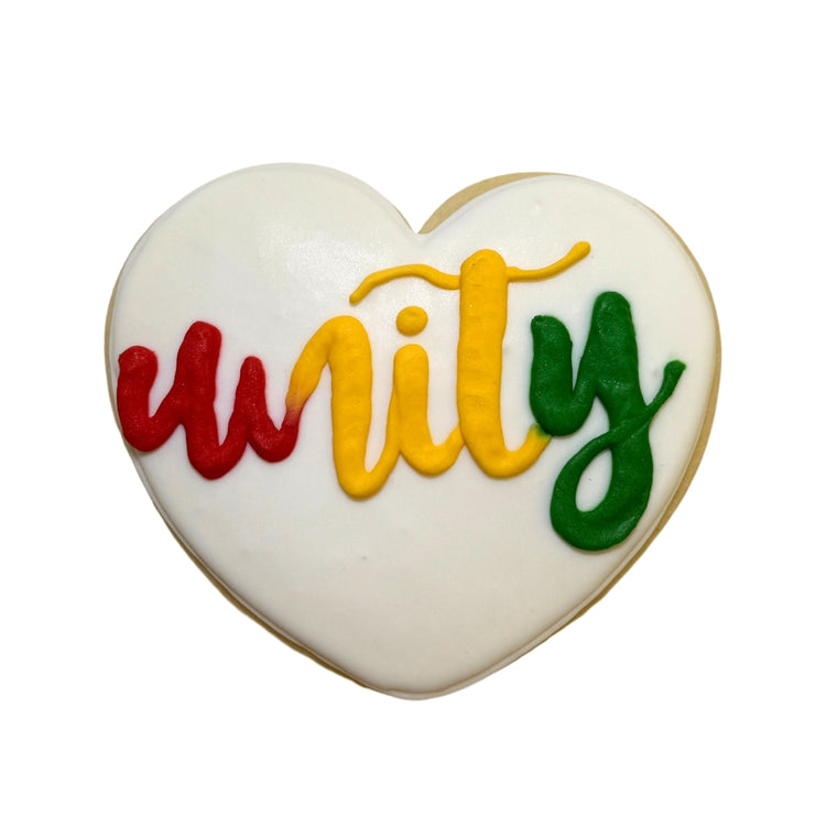 Heart-shaped Juneteenth cookie with Unity in colorful icing.