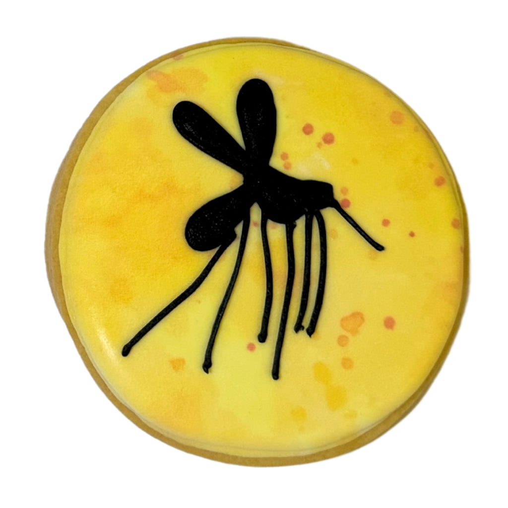 Jurassic Cookie with yellow icing and black mosquito design