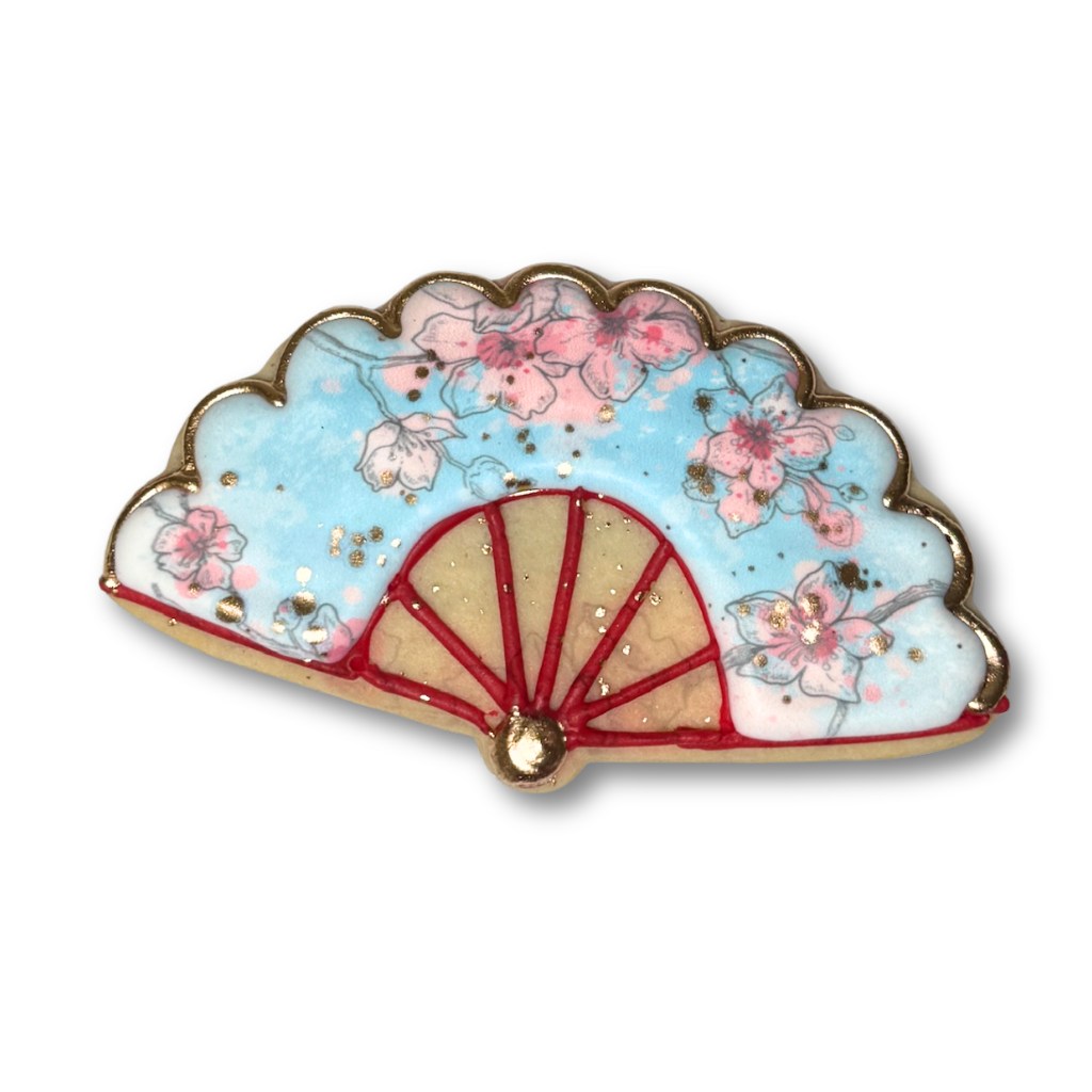 Lunar New Year fan-shaped cookie with blue floral icing