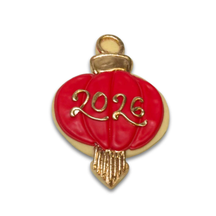 Red lantern Lunar New Year cookie with gold 2026 icing.