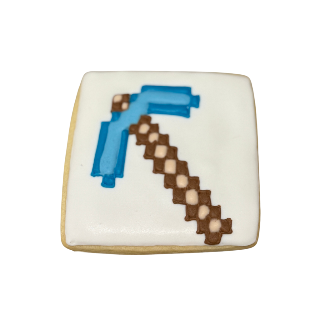 Square Minecraft cookie with a blue and brown pickaxe design.