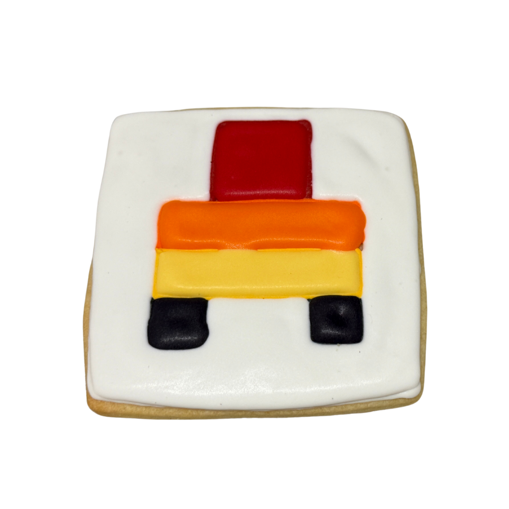 Minecraft cookie with red, orange, yellow, and black icing.