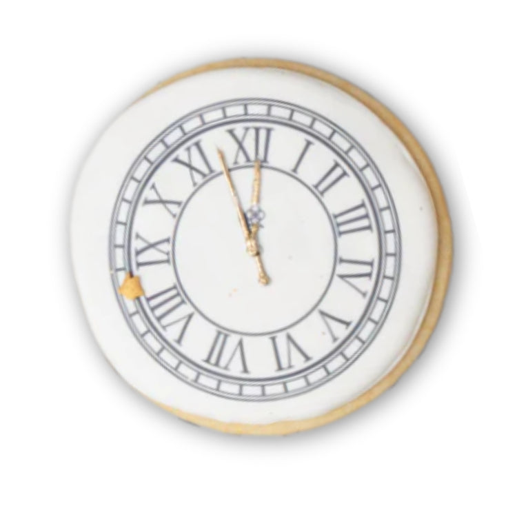 New Year cookie shaped like a clock with Roman numerals.