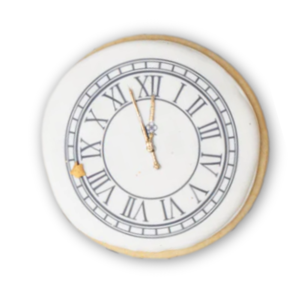 New Year cookie shaped like a clock with Roman numerals.