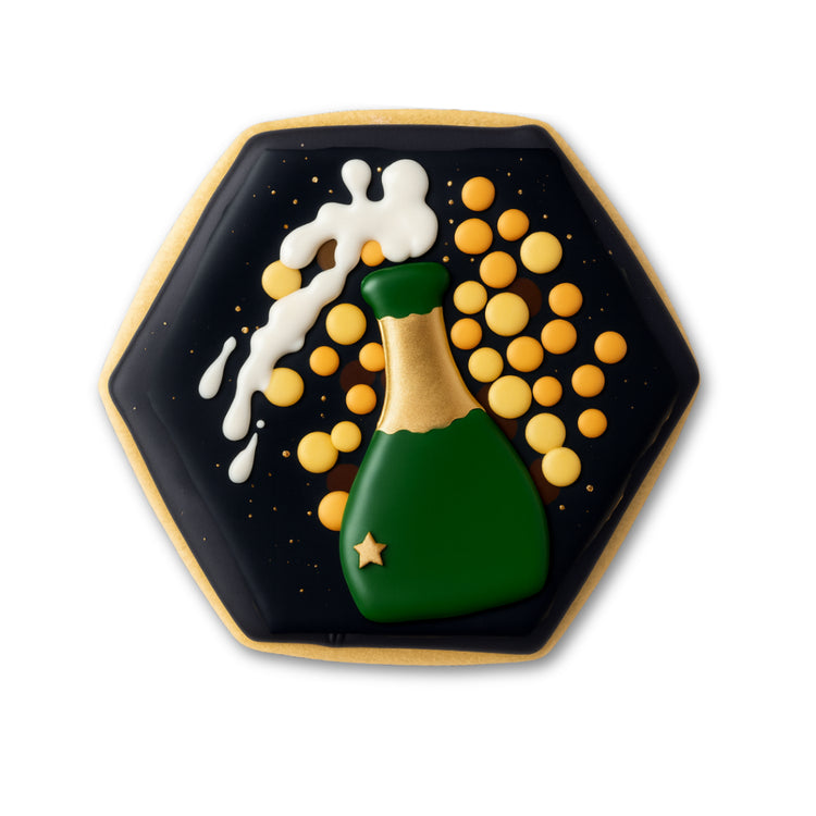 Hexagonal New Year cookie with champagne bottle icing