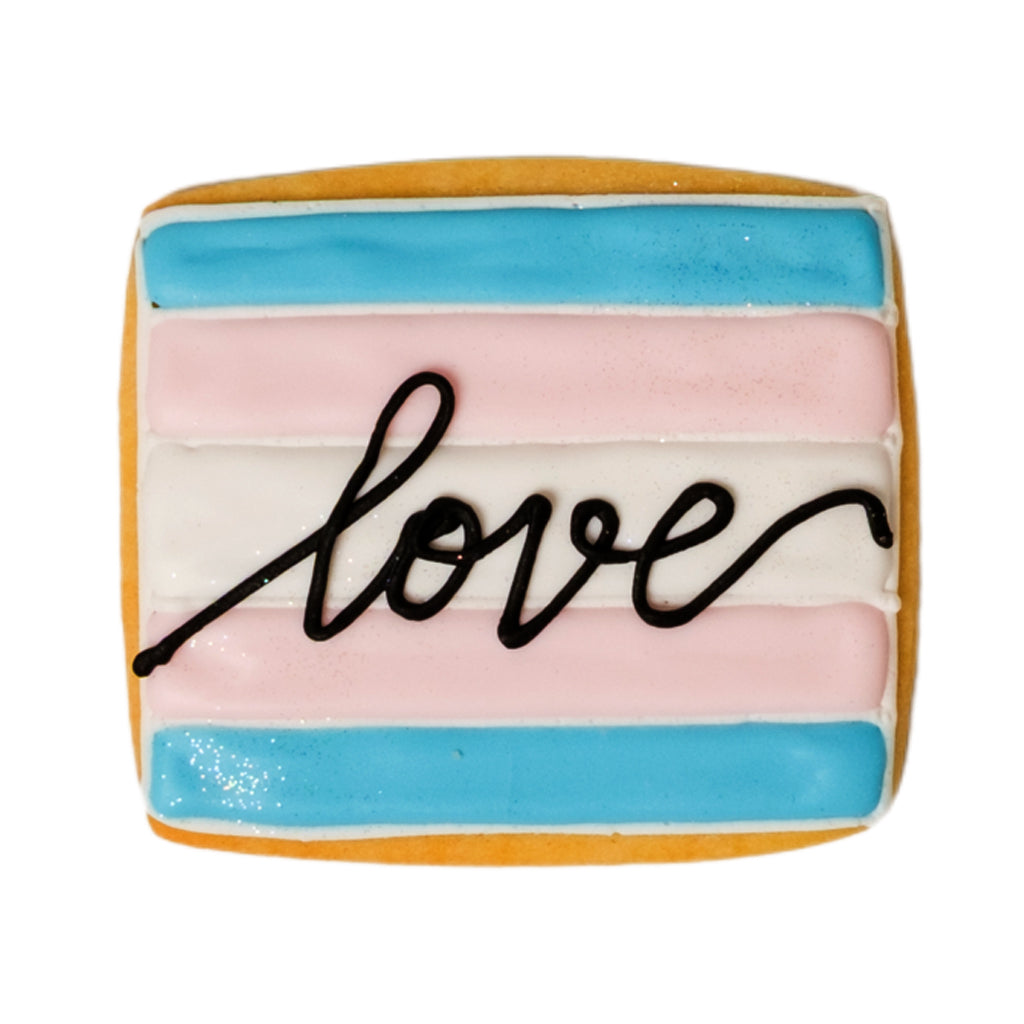 Trans Day of Visibility cookie with blue, pink, and white icing.