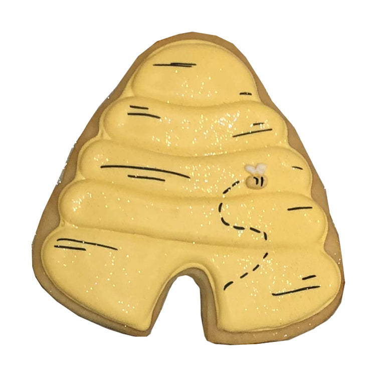 Winnie the Pooh beehive cookie with yellow icing and a bee.