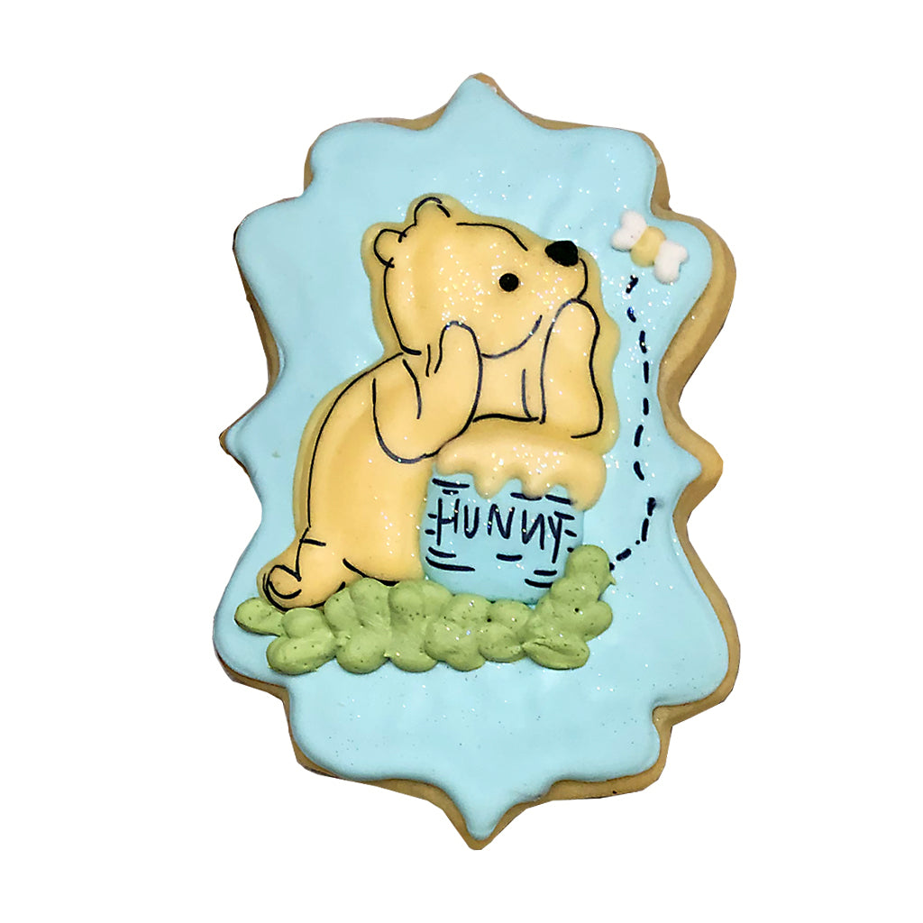 Winnie & Hunny cookie with blue icing and a honey pot.