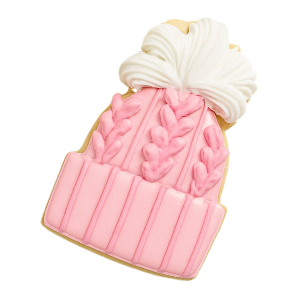 Christmas Couture cookie shaped like a pink knit winter hat.