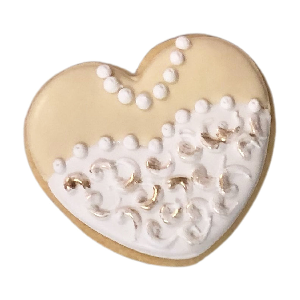 Wedding Dress Heart cookie with white icing and gold accents.