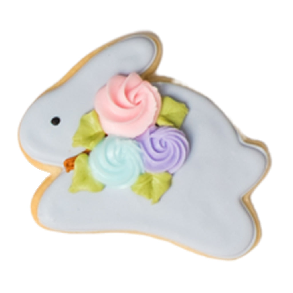 Easter butter cookie shaped like a blue bunny with floral icing.