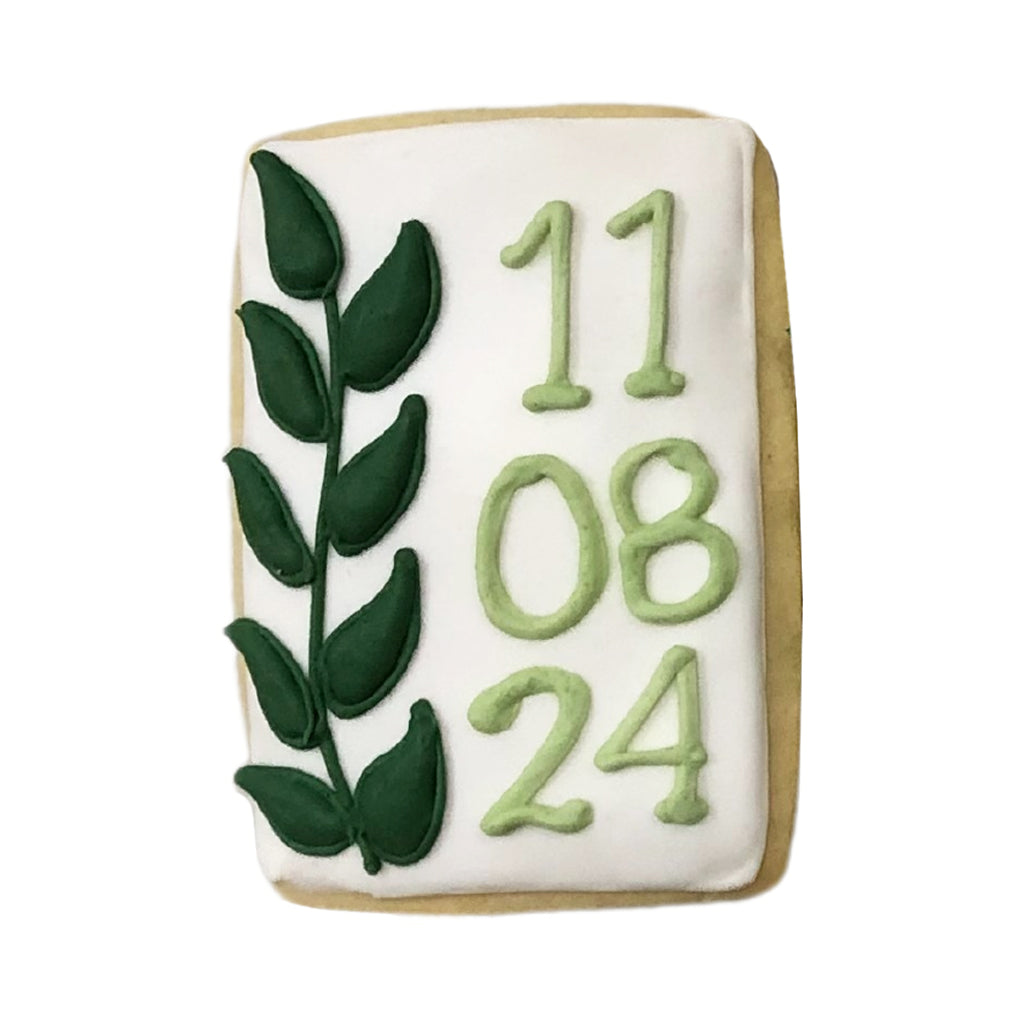 Wedding date plaque cookie with green leaf and date design