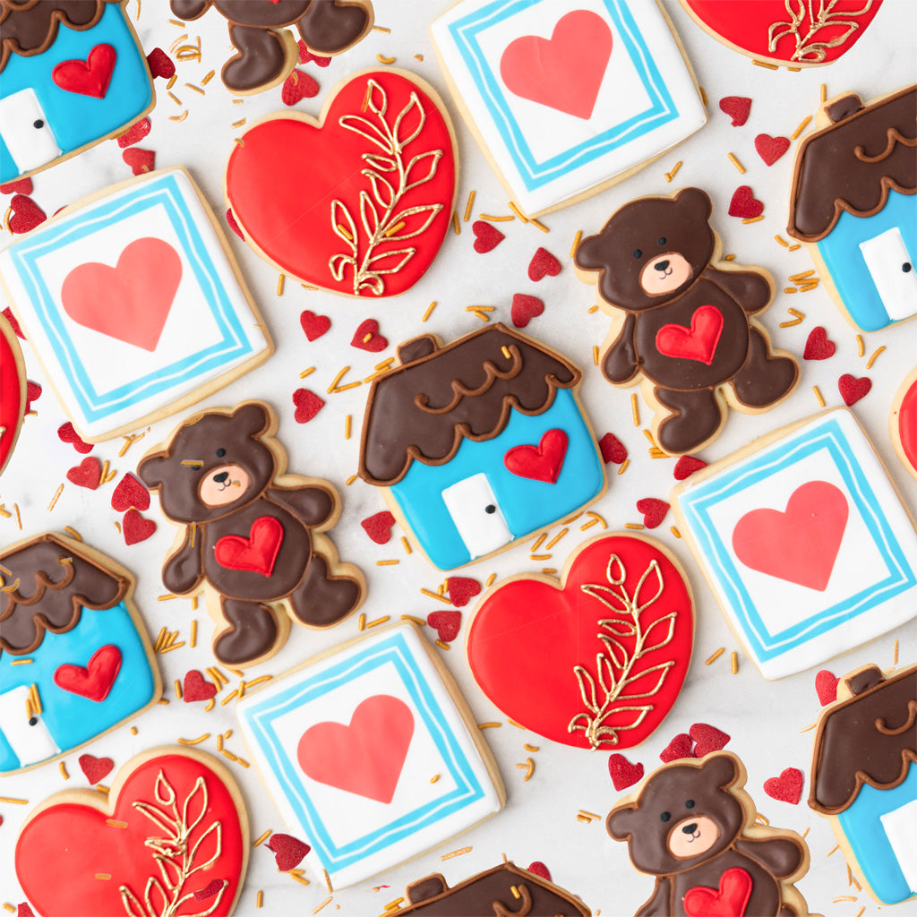 Valentine's Day cookies shaped like bears, hearts, and houses