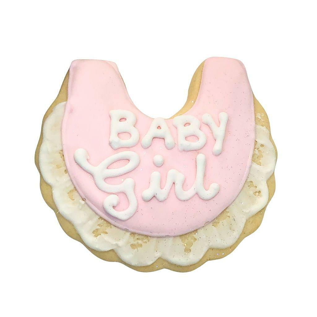 Baby Girl #1 bib-shaped cookie with pink icing and ruffles