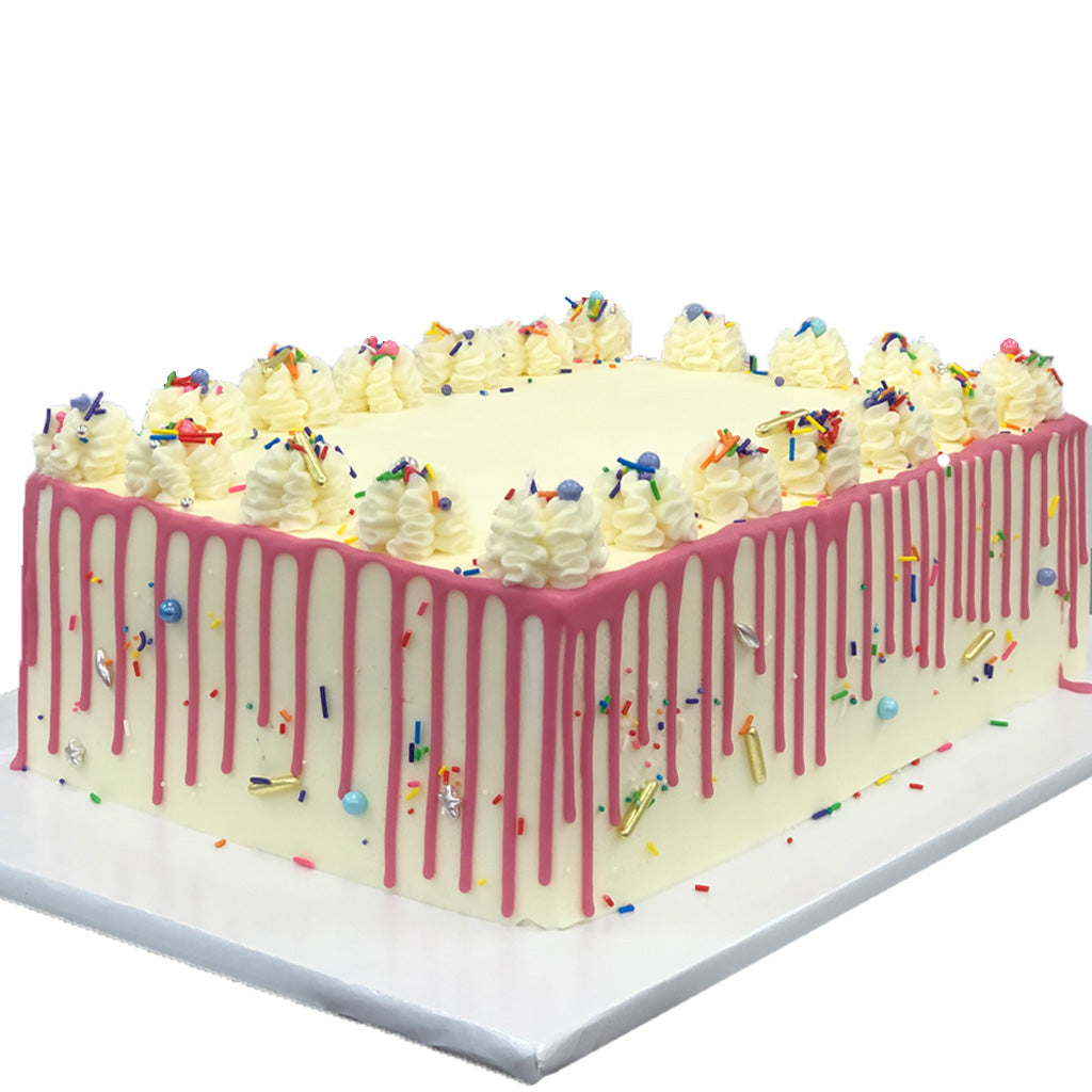 French Vanilla sheet cake with pink drip and sprinkles.