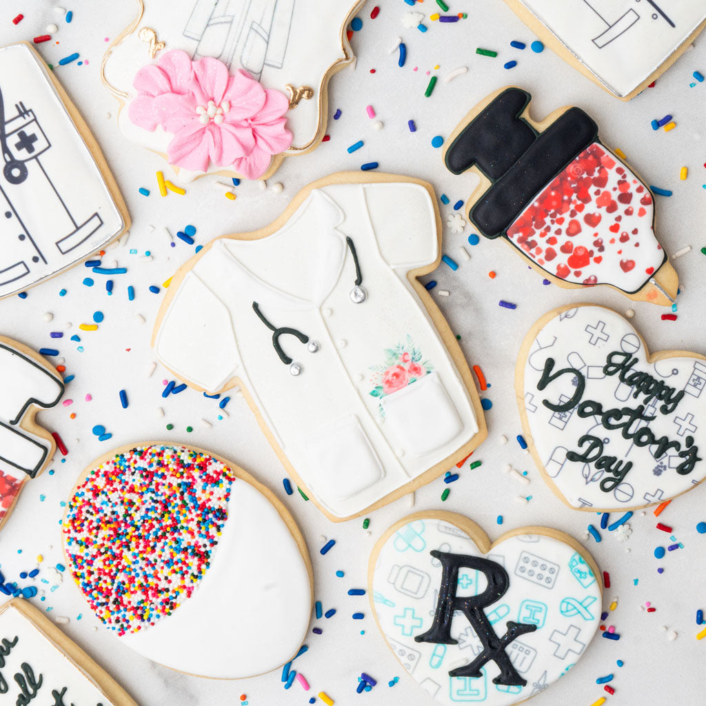 Assorted medical school graduation cookies with colorful sprinkles