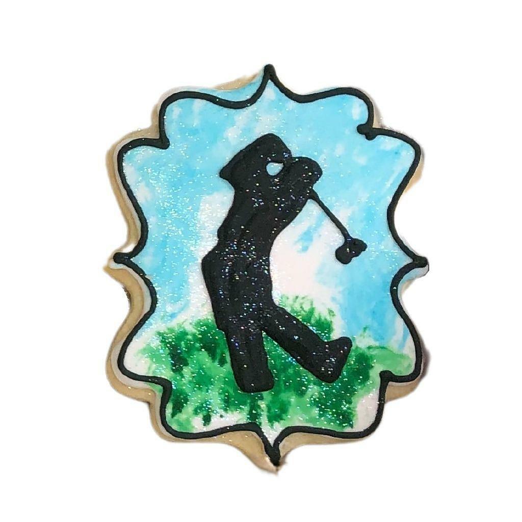 Golf birthday gift box cookie with a golfer silhouette design.