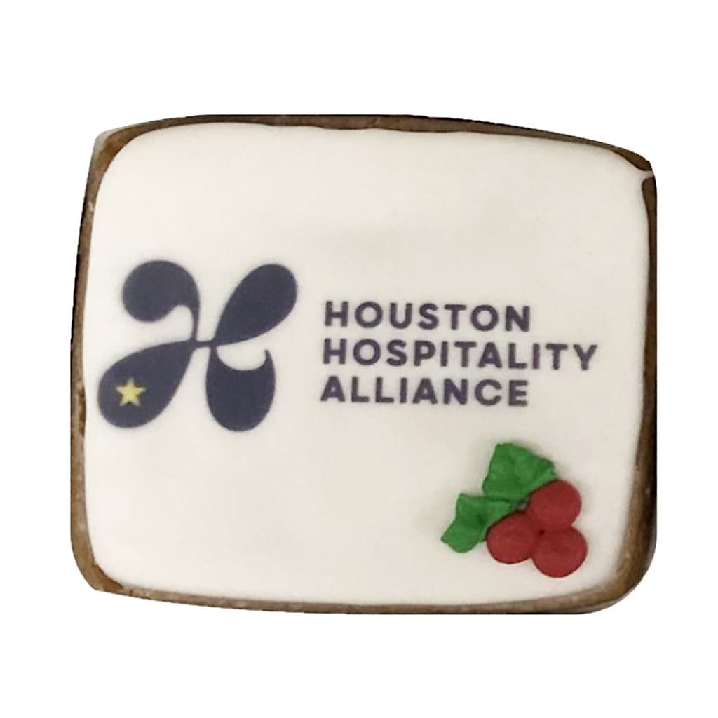 Houston Hospitality Alliance square cookie with holly decor.