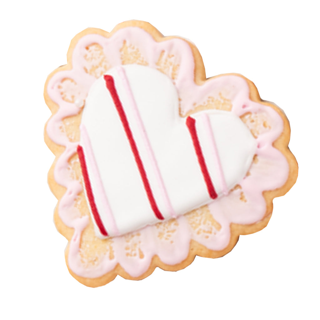 Heart-shaped Valentine butter cookie with pink lace icing.