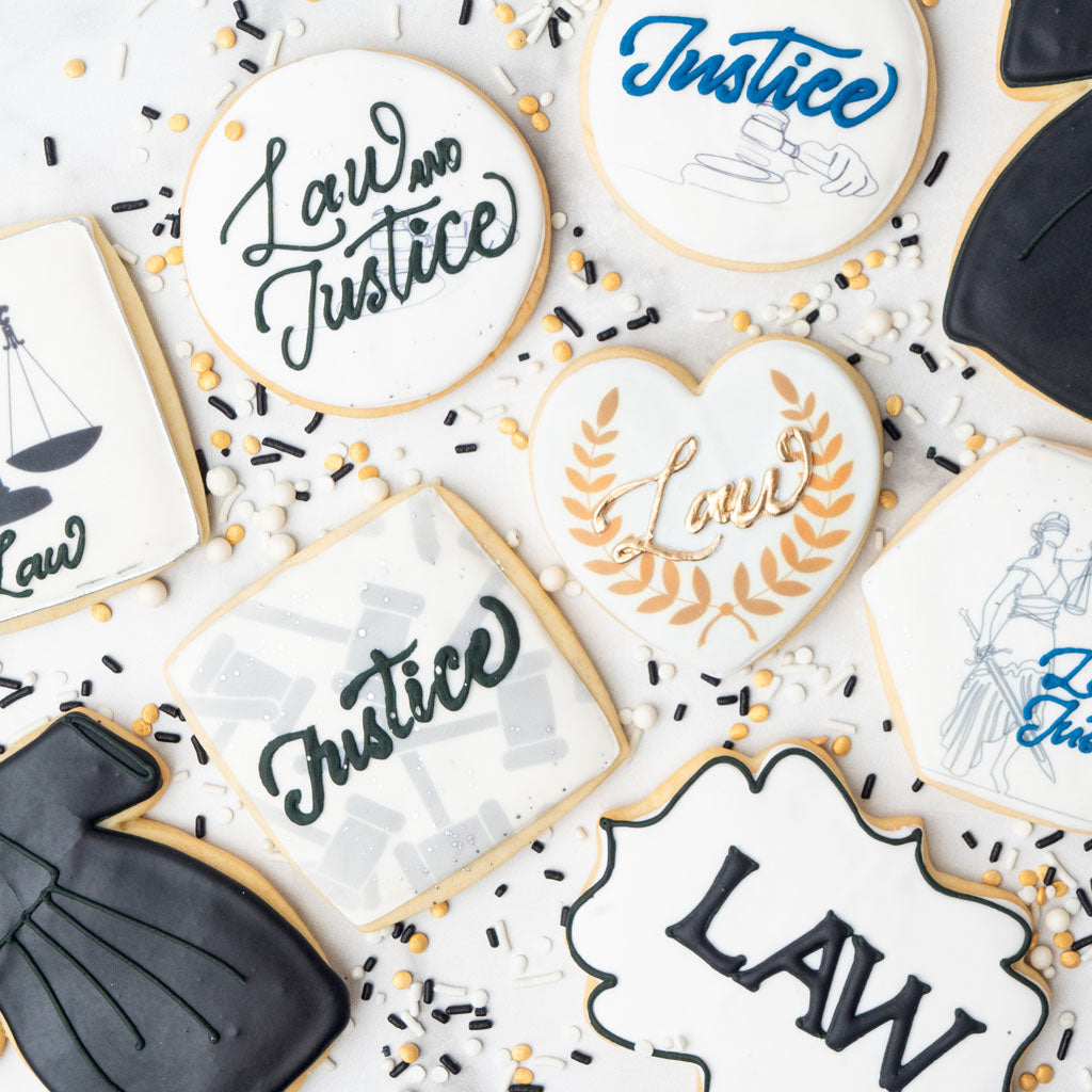 Assorted law school graduation cookies with legal motifs.