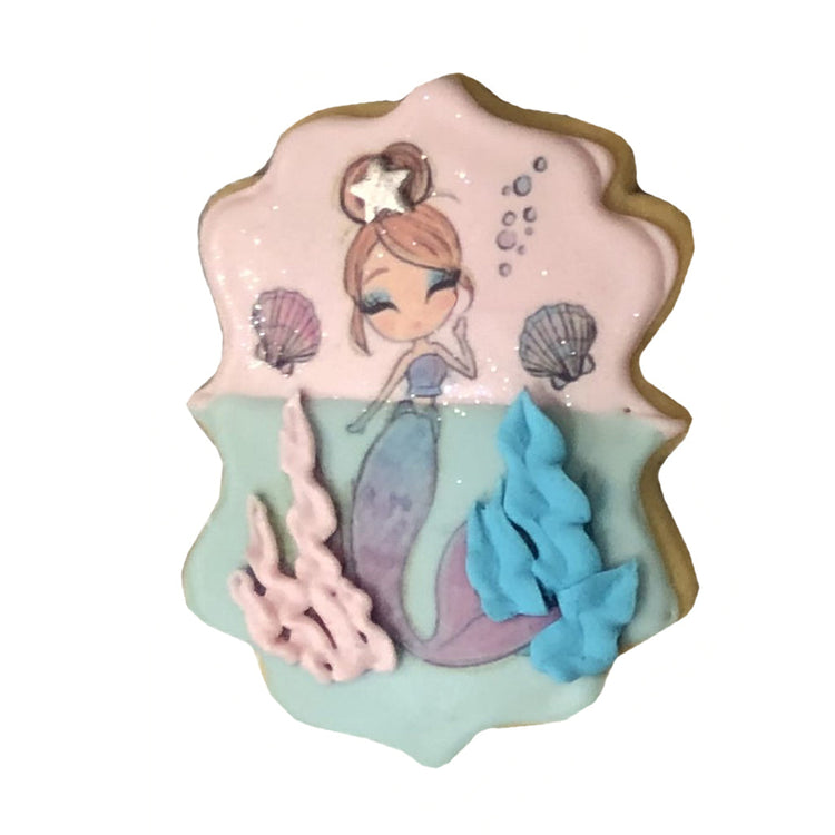 Little Mermaid cookie with pink and blue icing details.