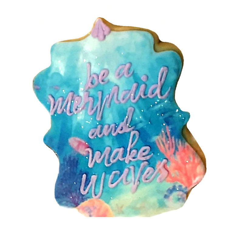 Little Mermaid cookie with blue watercolor and purple text.