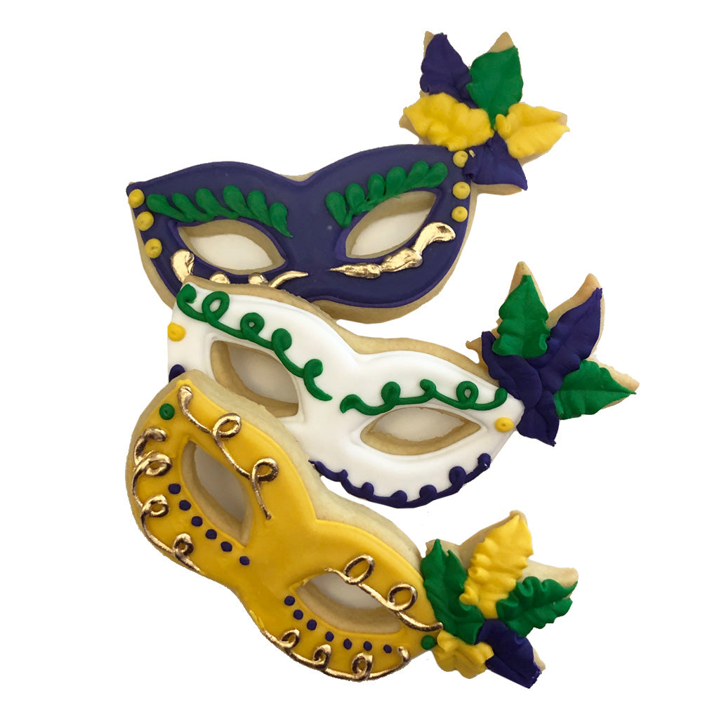 Mardi Gras butter cookies shaped like purple, white, and gold masks.