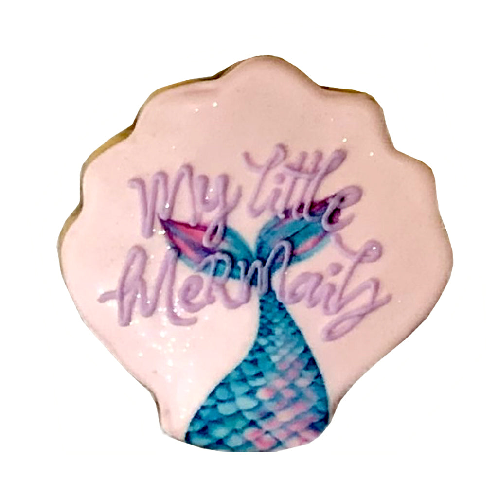 Little Mermaid shell-shaped cookie with purple icing text