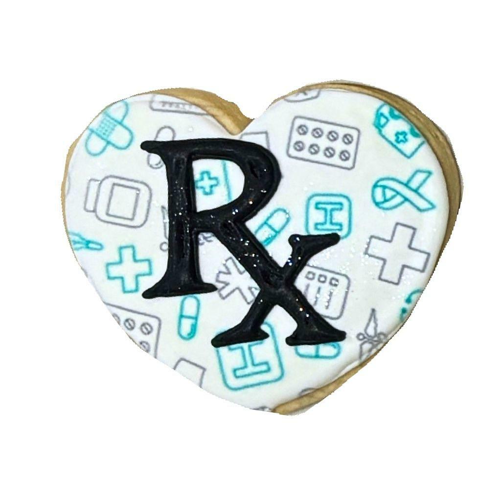 Heart-shaped Doctors' Week cookie with Rx symbol pattern.