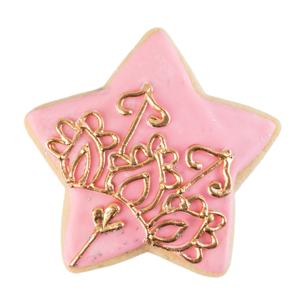 Star-shaped Ramadan butter cookie with pink icing and gold detail