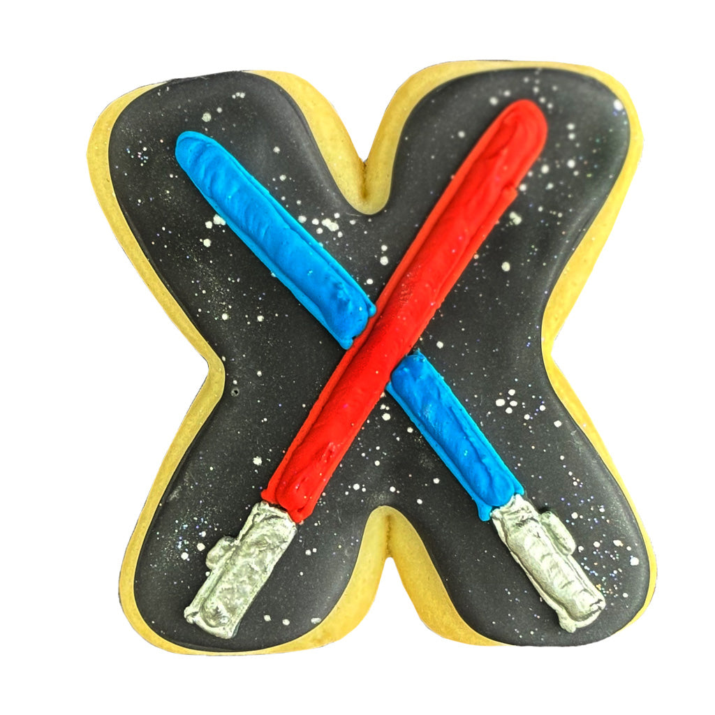 Star Wars letter X cookie with red and blue lightsabers