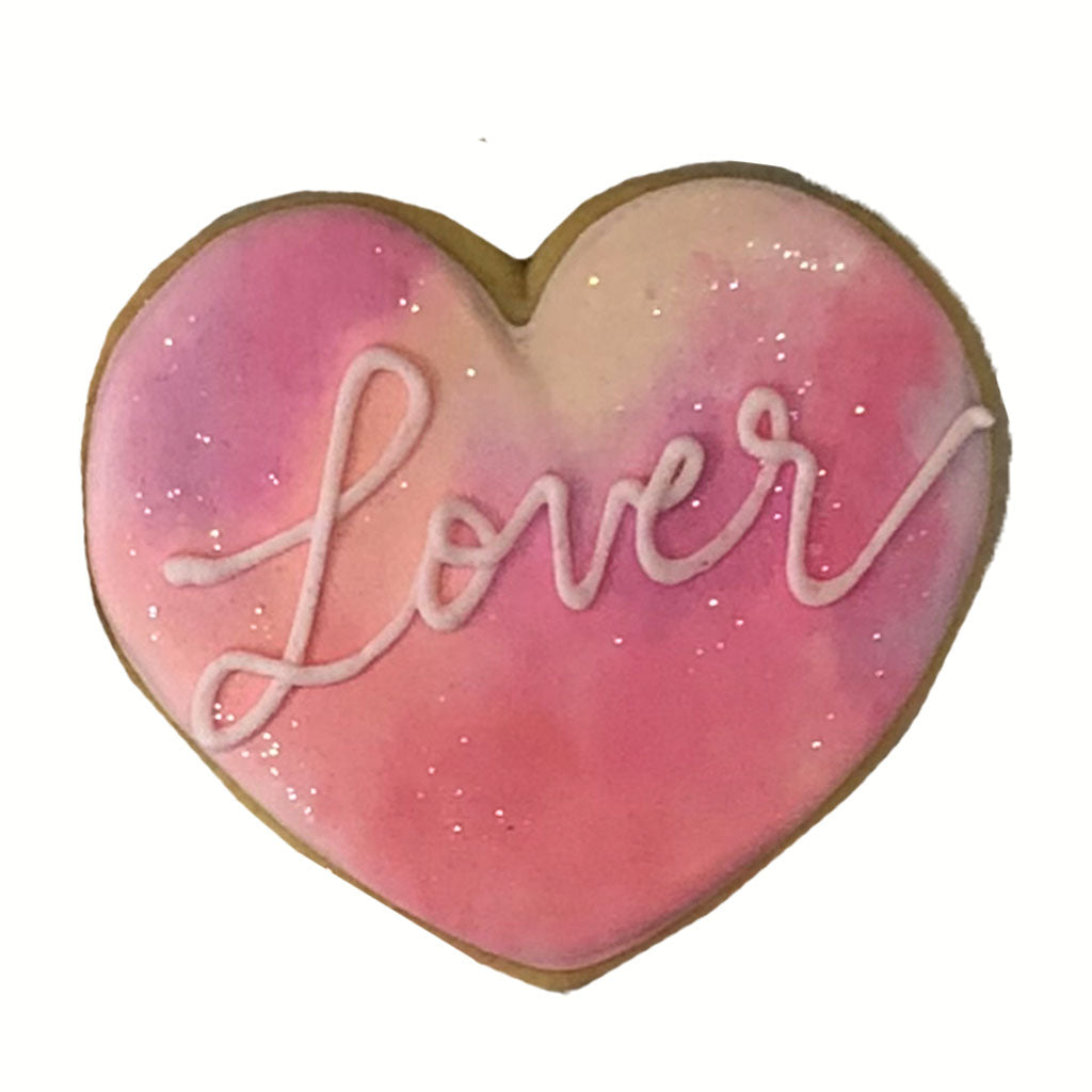 Taylor Swift Lover heart-shaped cookie with pink watercolor icing