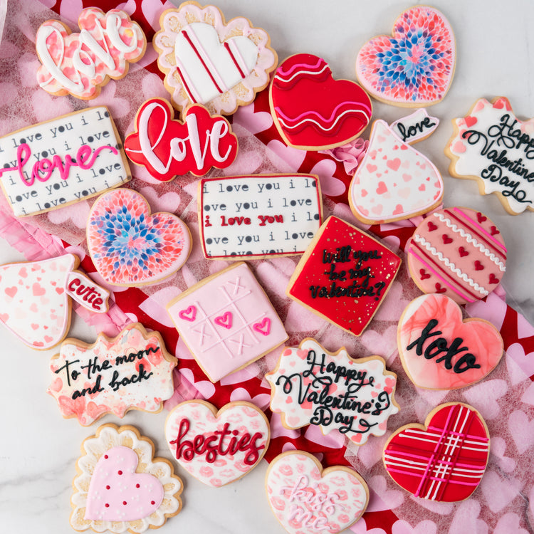 Assorted Valentine butter cookies with festive icing designs.