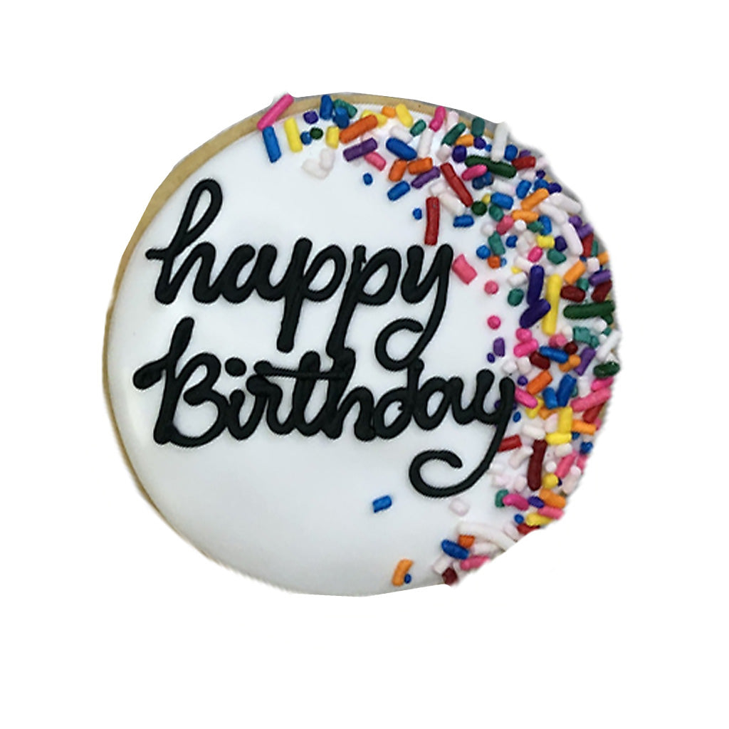 Round birthday plaque cookie with white icing and sprinkles.