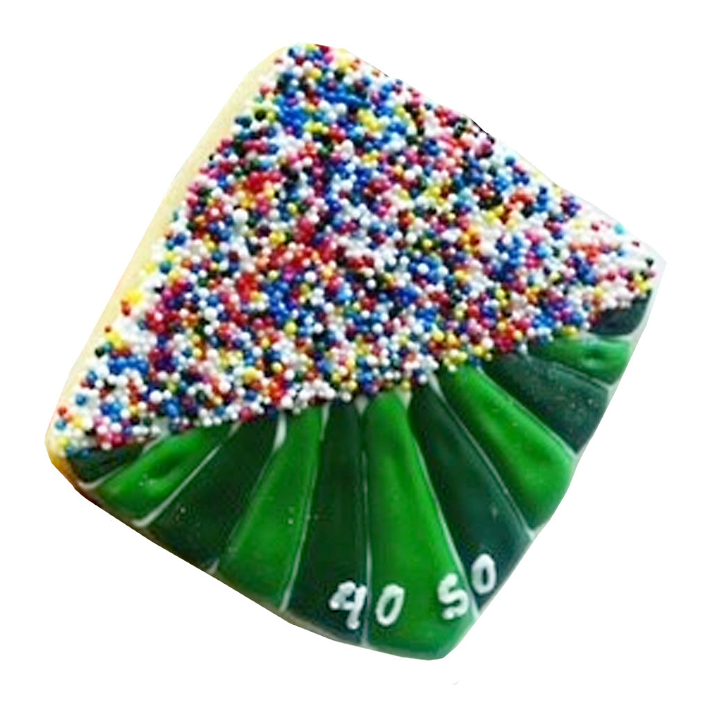 Football stadium cookie with green icing and colorful sprinkles.