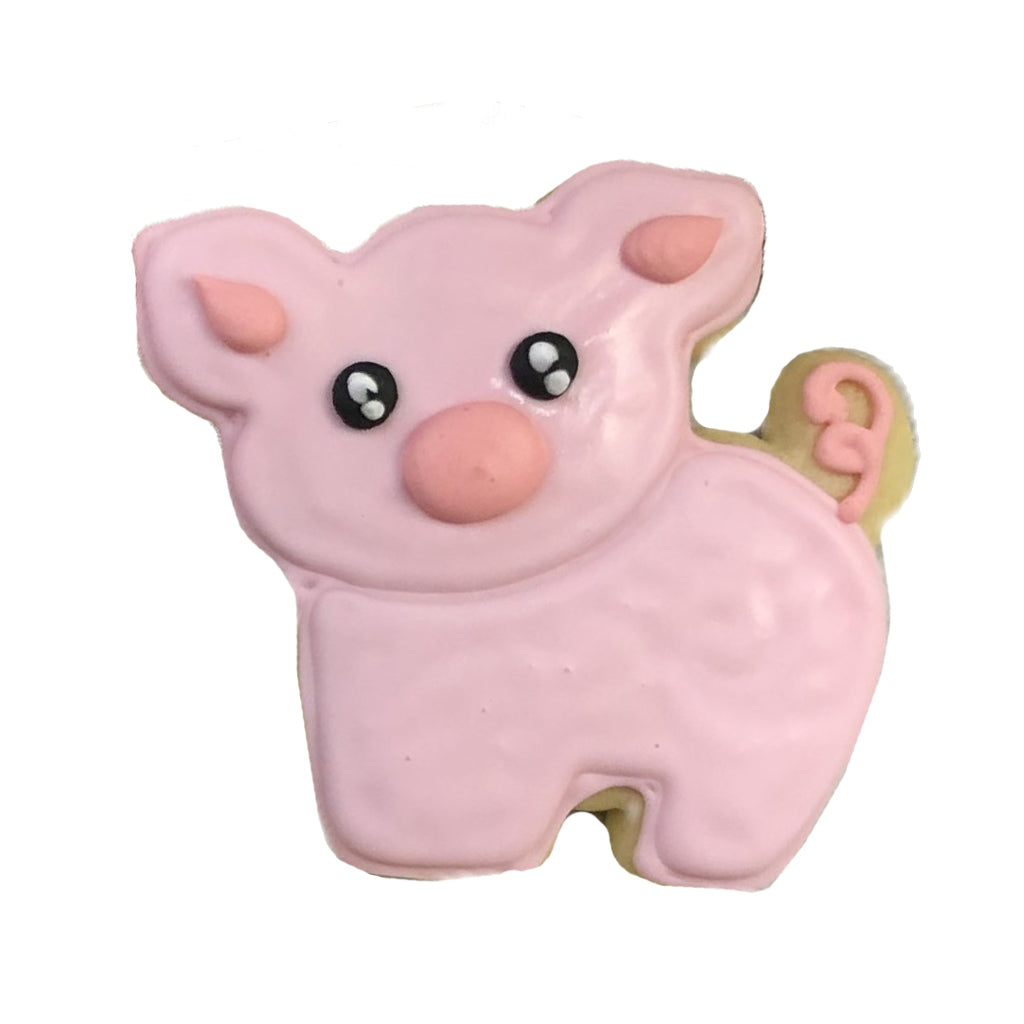This Little Piggy cookie with pink icing and a curly tail.